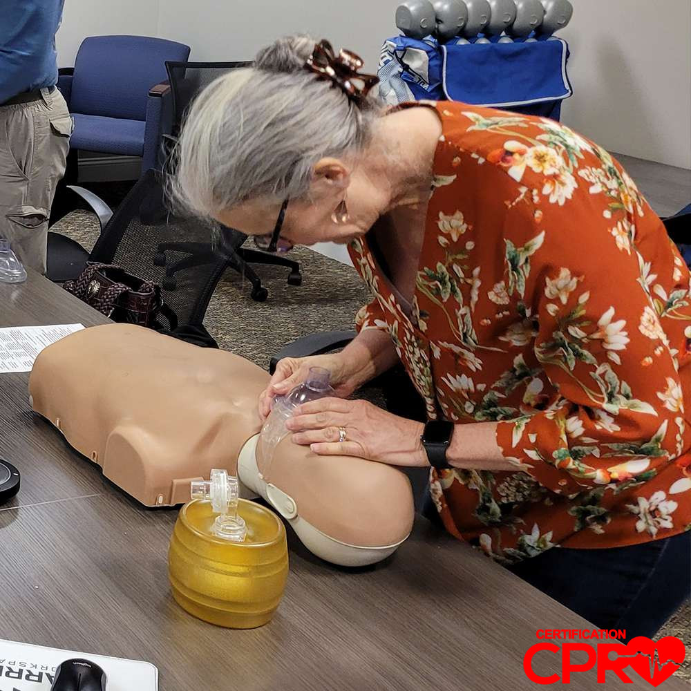 CPR training session with adult mannequin in Orlando.