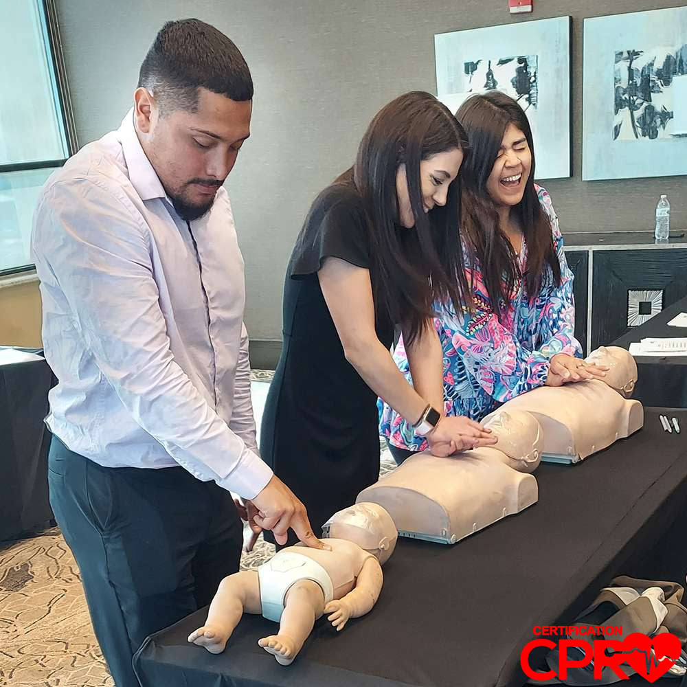 CPR training class in Orlando with students practicing on mannequins.